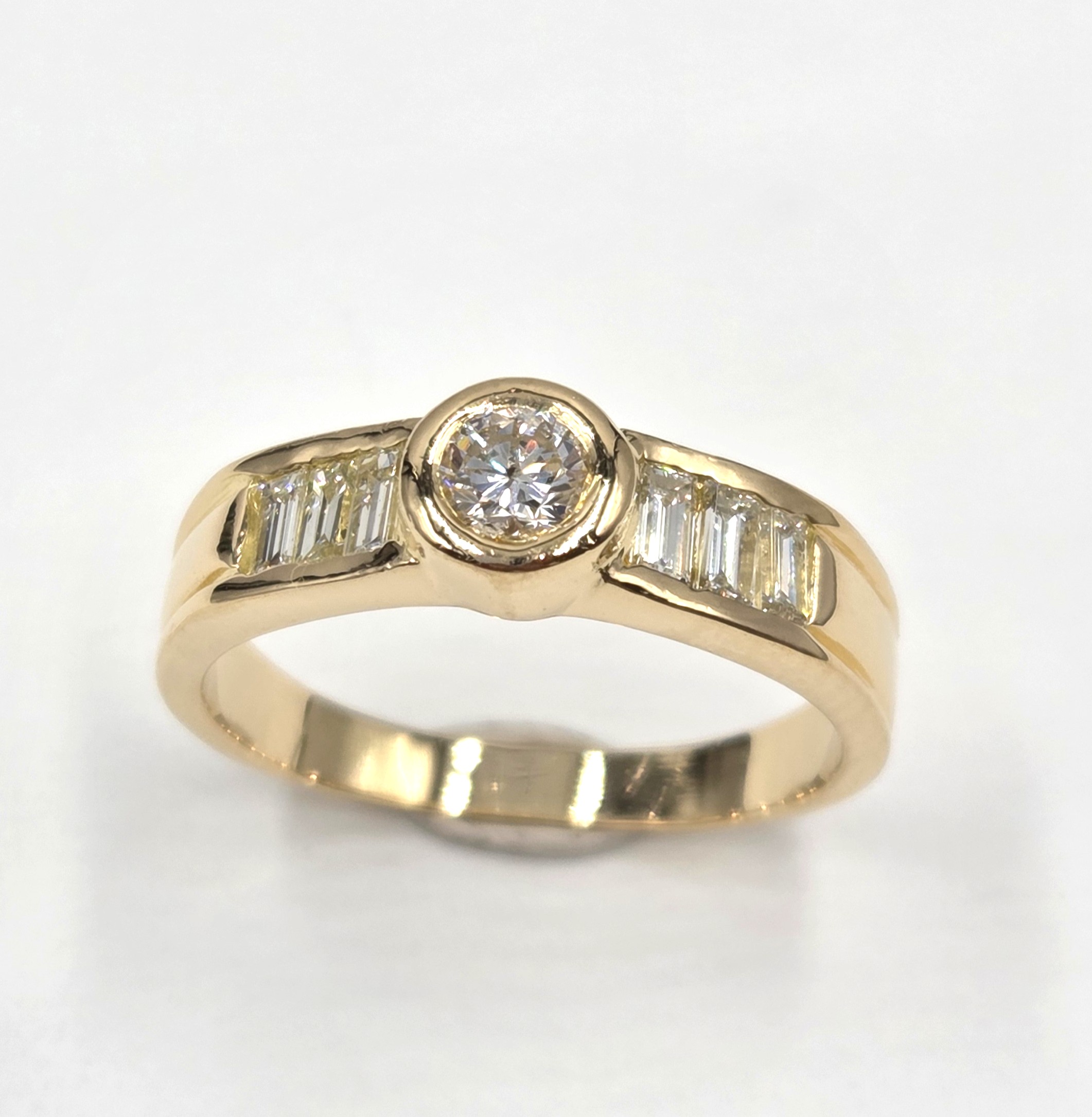bague occasion seconde main diamant rond taille brillant et diamants baguette