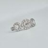 Bague trilogie en or blanc avec trois diamants ronds entourés de halos pavés
